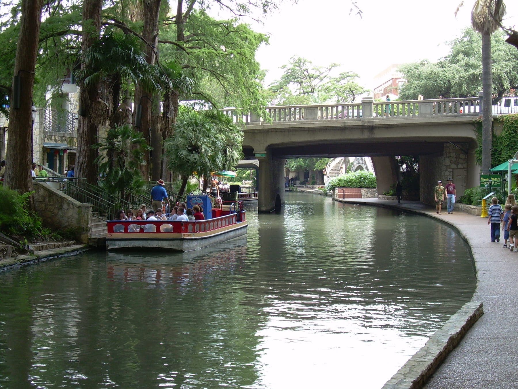 The San Antonio River Walk today — stone walkways, arched bridges, bald cypress
