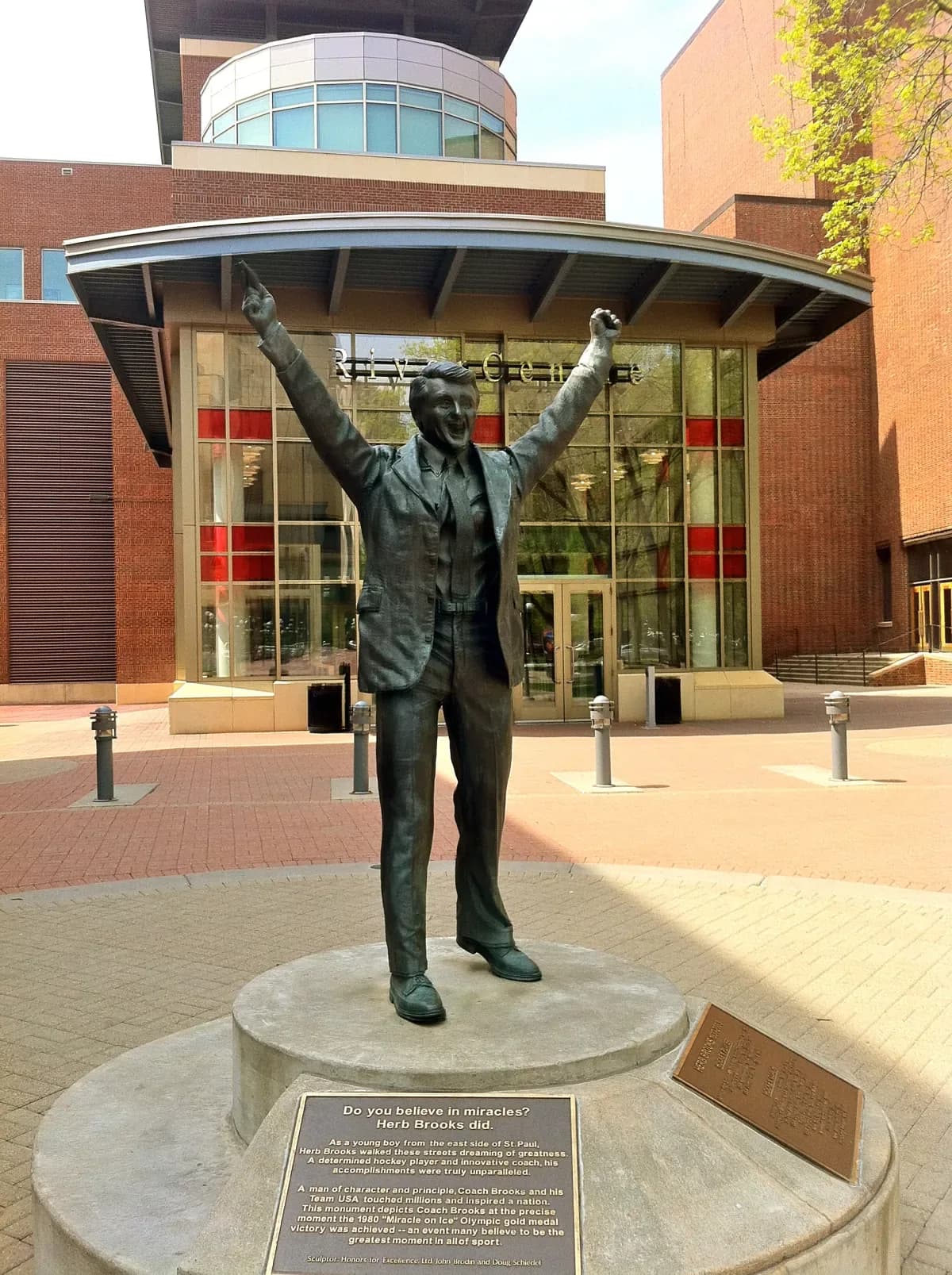 Herb Brooks statue outside the RiverCentre — the coach with both arms raised in victory