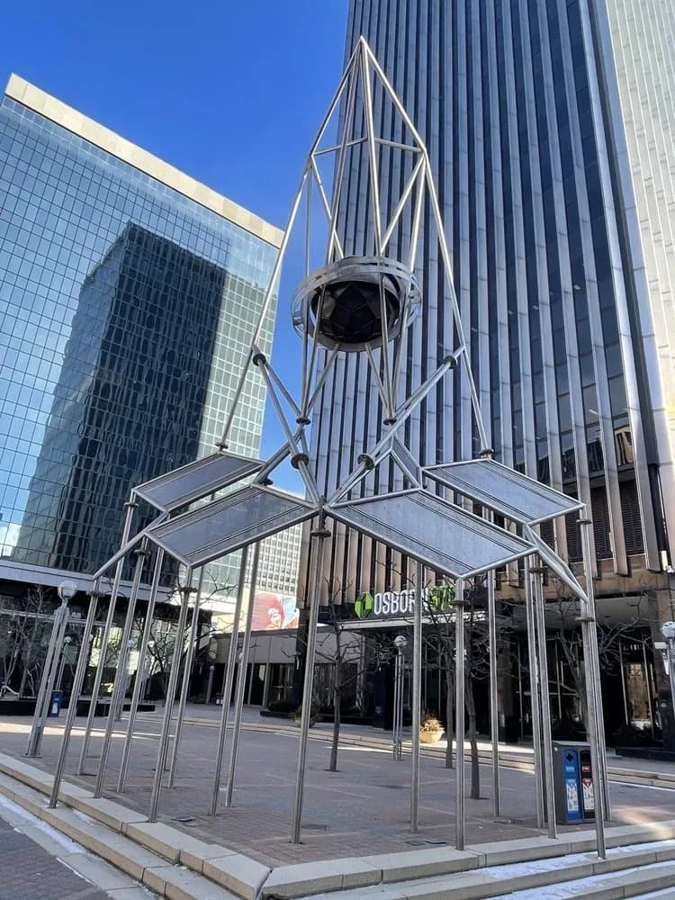 Skygate, R.M. Fischer's steel lattice tower sculpture rising over a downtown Saint Paul plaza